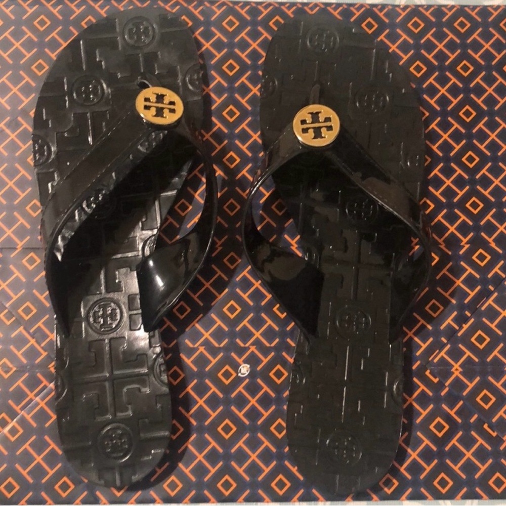 Tory Burch Black Jelly Flip Flops with Gold Logo Medallion